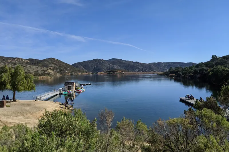 Dixon Lake in Escondido seen from the shore, chaparral hills around the water under a clear sky